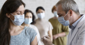 https://www.freepik.com/free-photo/woman-getting-vaccine-shot-by-doctor-with-medical-mask_14833604.htm
