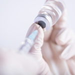 female-doctor-hands-holding-syringe-vaccine