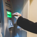 close-up-on-the-hand-of-man-inserting-debit-card-in-atm-machine-money-cash-concept-SBI-304224182