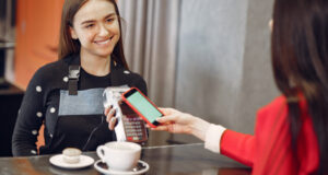 https://www.freepik.com/free-photo/girl-paying-her-latte-with-smartphone-by-contactless-pay-pass-technology_9246460.htm#page=1&query=contactless%20payment&position=1&from_view=search