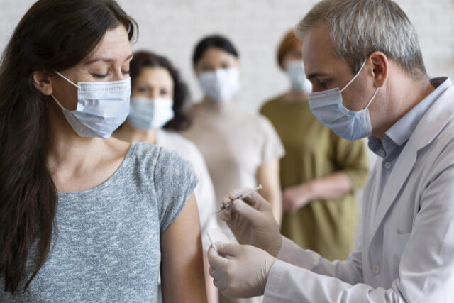 https://www.freepik.com/free-photo/woman-getting-vaccine-shot-by-doctor-with-medical-mask_14833604.htm?query=covid%20vaccine