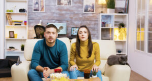 https://www.freepik.com/free-photo/couple-sitting-couch-cheering-up-while-watching-sports-tv-eating-junk-food-with-their-cat-them_21017161.htm?query=person%20snacking