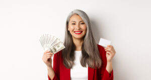 https://www.freepik.com/free-photo/successful-asian-senior-businesswoman-showing-money-dollars-plastic-card-smiling-happy-camera-wearing-red-blazer-make-up_19081247.htm#query=credit%20card%20cash&position=15&from_view=search
