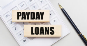https://www.freepik.com/premium-photo/wooden-blocks-with-payday-loans-lie-light-background-white-calculator-nearby-is-black-handle-business-concept_22540548.htm#query=payday%20loan&position=9&from_view=search