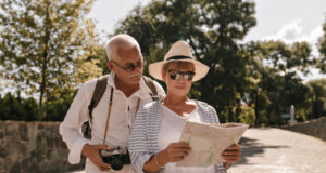 https://www.freepik.com/free-photo/modern-woman-white-tshirt-striped-blouse-hat-glasses-looking-map-walking-with-grey-haired-man-shirt-with-camera-outdoor_23937660.htm#query=senior%20travel&position=17&from_view=search