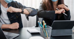 https://www.vecteezy.com/photo/2448550-two-young-diverse-business-colleagues-wearing-face-protective-masks-bumping-elbows-greeting-each-other-while-working-during-covid-19-quarantine