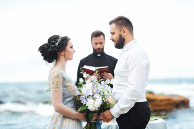 https://www.vecteezy.com/photo/2403480-wedding-couple-on-the-ocean-with-a-priest