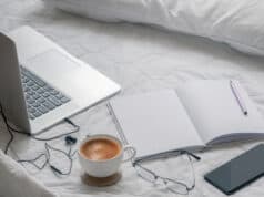 https://www.vecteezy.com/photo/1309972-laptop-with-a-coffee-phone-and-notebook-on-a-bed