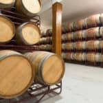 Many wooden barrels in  cellar