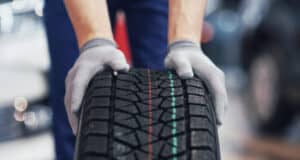 https://www.freepik.com/free-photo/closeup-mechanic-hands-pushing-black-tire-workshop_9122514.htm#query=tires&position=26&from_view=search