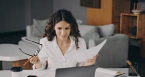 https://www.vecteezy.com/photo/7799068-smiling-glad-italian-woman-paying-bills-online-at-home-while-sitting-on-living-room