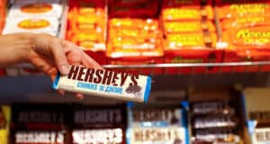An employee shows a Hershey's chocolate bar made in USA in the "American lifestyle" store in Berlin, Germany, August 13, 2018. REUTERS/Fabrizio Bensch