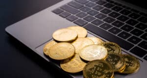 https://www.vecteezy.com/photo/9332208-golden-coins-with-bitcoin-symbol-on-computer