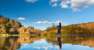 https://www.vecteezy.com/photo/9828044-fisherman-boy-on-panoramic-landscape-with-wide-broad-river-in-autumn-forest-in-sunny-day-with-reflection