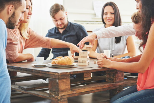 https://www.vecteezy.com/photo/6240661-group-of-creative-friends-sitting-at-wooden-table-people-having-fun-while-playing-board-game