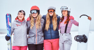 https://www.freepik.com/free-photo/cheerful-women-friends-sports-winter-clothes-with-snowboards-skis-standing-together-hug-looking-camera-snowy-beach_28992673.htm#query=snow%20skiing&position=40&from_view=search&track=sph