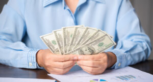 https://www.vecteezy.com/photo/10568396-close-up-young-business-woman-using-counting-cash-money-one-hundred-dollar-bills-checking-financial-documents-sitting-at-table