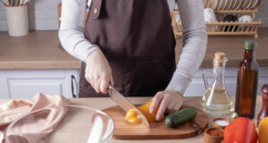 https://www.vecteezy.com/photo/12875777-a-young-girl-cuts-yellow-fresh-pepper-on-a-cutting-board-cooking-vegetable-salad-in-the-kitchen-at-home