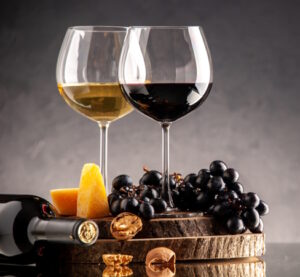 https://www.freepik.com/free-photo/front-view-wine-glasses-fresh-grapes-walnuts-yellow-cheese-wood-board-overturned-bottle-dark-background_17232192.htm#query=wine&position=11&from_view=search&track=sph