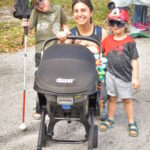 Client Isaac A., his mom Joanna and younger brothers Robert and Dylan (in the  stroller).