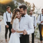 beautiful-bride-groom-having-their-wedding-with-guests-beach