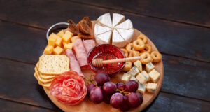 https://www.freepik.com/premium-photo/appetizers-board-with-assorted-cheese-meat-sausage-rosette-grape-salty-cookies_26550753.htm#query=Charcuterie&position=15&from_view=search&track=sph
