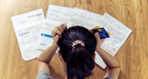 https://www.freepik.com/premium-photo/top-view-stressed-young-sitting-asian-woman-hands-holding-head-worry-about-find-money-pay-credit-card-debt-all-loan-bills_4545002.htm#page=2&query=get%20out%20of%20debt&position=24&from_view=search&track=ais