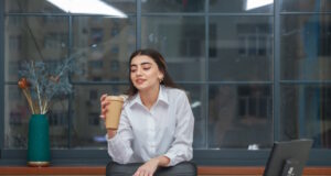 https://www.freepik.com/free-photo/beautiful-girl-holding-coffee-cup-takes-break-office-high-quality-photo_26087406.htm#query=drink%20at%20desk&position=5&from_view=search&track=ais