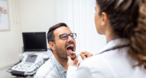 https://www.freepik.com/free-photo/doctor-using-inspection-spatula-examine-patient-throat-ent-doctor-doing-throat-exam-patient-opened-his-mouth-throat-checkup_28001807.htm#query=tonsils&position=4&from_view=search&track=sph