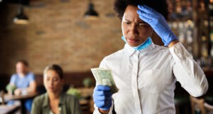 https://www.freepik.com/free-photo/african-american-waitress-feeling-dissatisfied-with-tip-from-customer-cafe_26401974.htm#page=3&query=tipping&position=37&from_view=search&track=sph