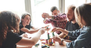 https://www.freepik.com/free-photo/group-creative-friends-sitting-wooden-table-people-were-having-fun-while-playing-board-game_9277743.htm#query=adult%20games&position=1&from_view=search&track=ais