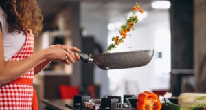 https://www.freepik.com/free-photo/woman-chef-cooking-vegetables-pan_8380328.htm#query=home%20cooking&position=6&from_view=search&track=ais