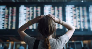 https://www.vecteezy.com/photo/24638050-bewildered-and-frustrated-young-adult-woman-looking-at-arrival-and-departure-board-at-the-crowded-airport-generative-ai