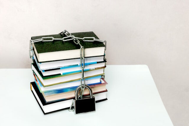 https://www.vecteezy.com/photo/23580121-stack-of-books-wrapped-in-a-chain-and-padlocked