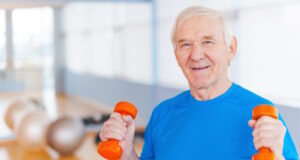 https://www.vecteezy.com/photo/13287771-on-the-road-to-recovery-happy-senior-man-exercising-with-dumbbells-and-smiling-while-standing-indoors