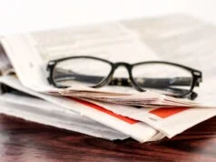 https://www.vecteezy.com/photo/25314096-newspaper-and-reading-glasses-on-wooden-table