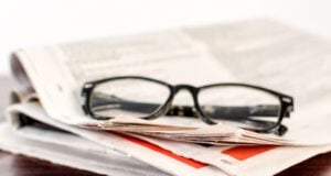 https://www.vecteezy.com/photo/25314096-newspaper-and-reading-glasses-on-wooden-table