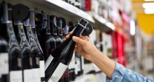 https://www.vecteezy.com/photo/6907005-woman-is-buying-a-bottle-of-wine-at-the-supermarket-background